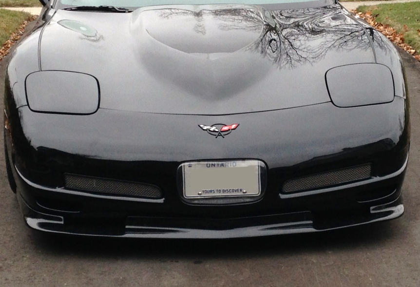 A c5 Corvette with an appearance lip added to the front of it that clearly prevents air from getting to the radiator. It's dumb, don't do this.