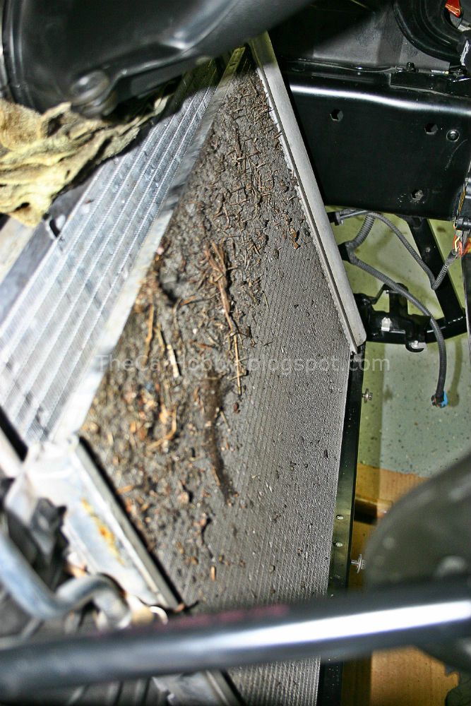 A c5 radiator and Condensor, with the Condensers clogged with dirt and debris