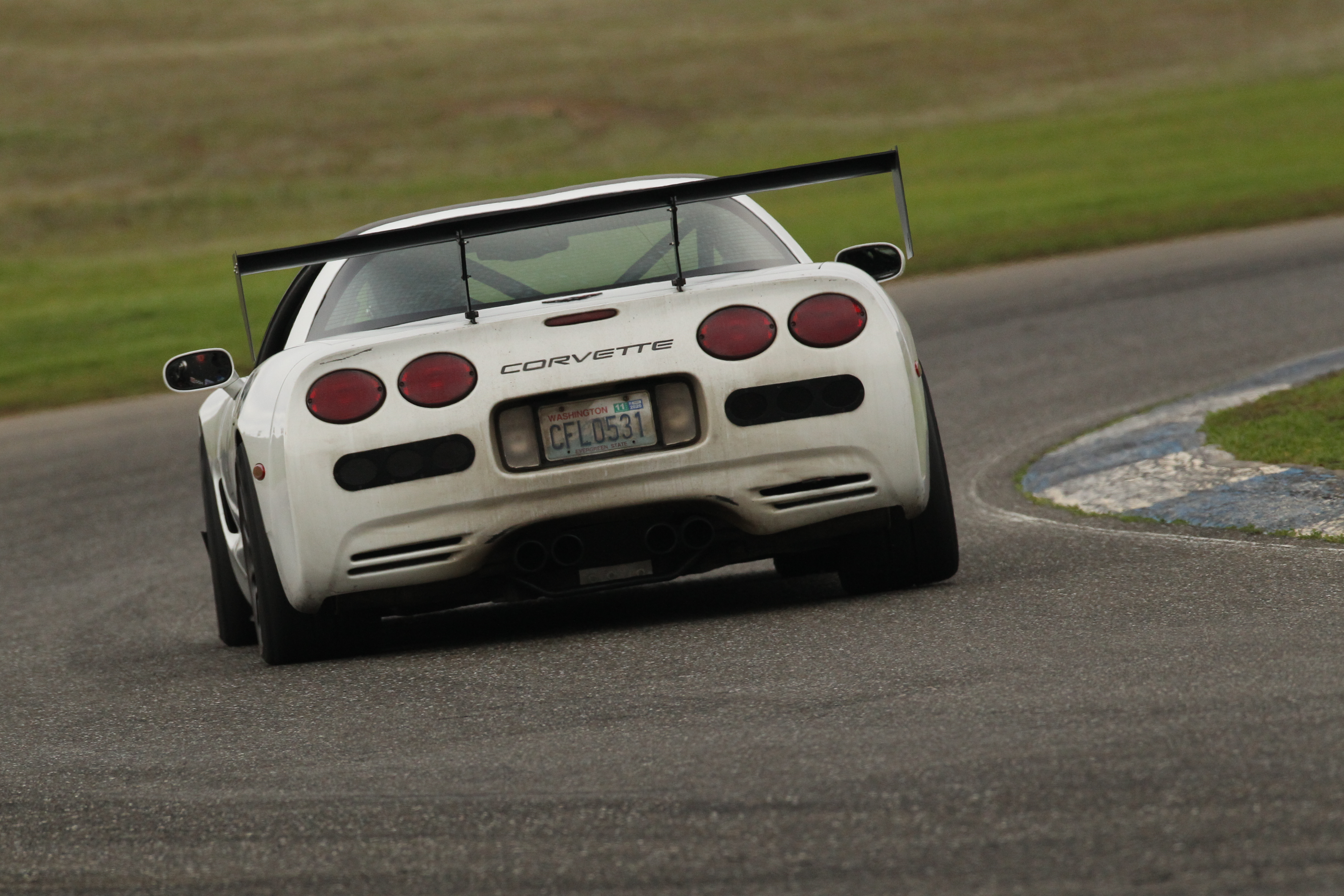 Shred Jesse's White C5 Corvette making a heavy right hander