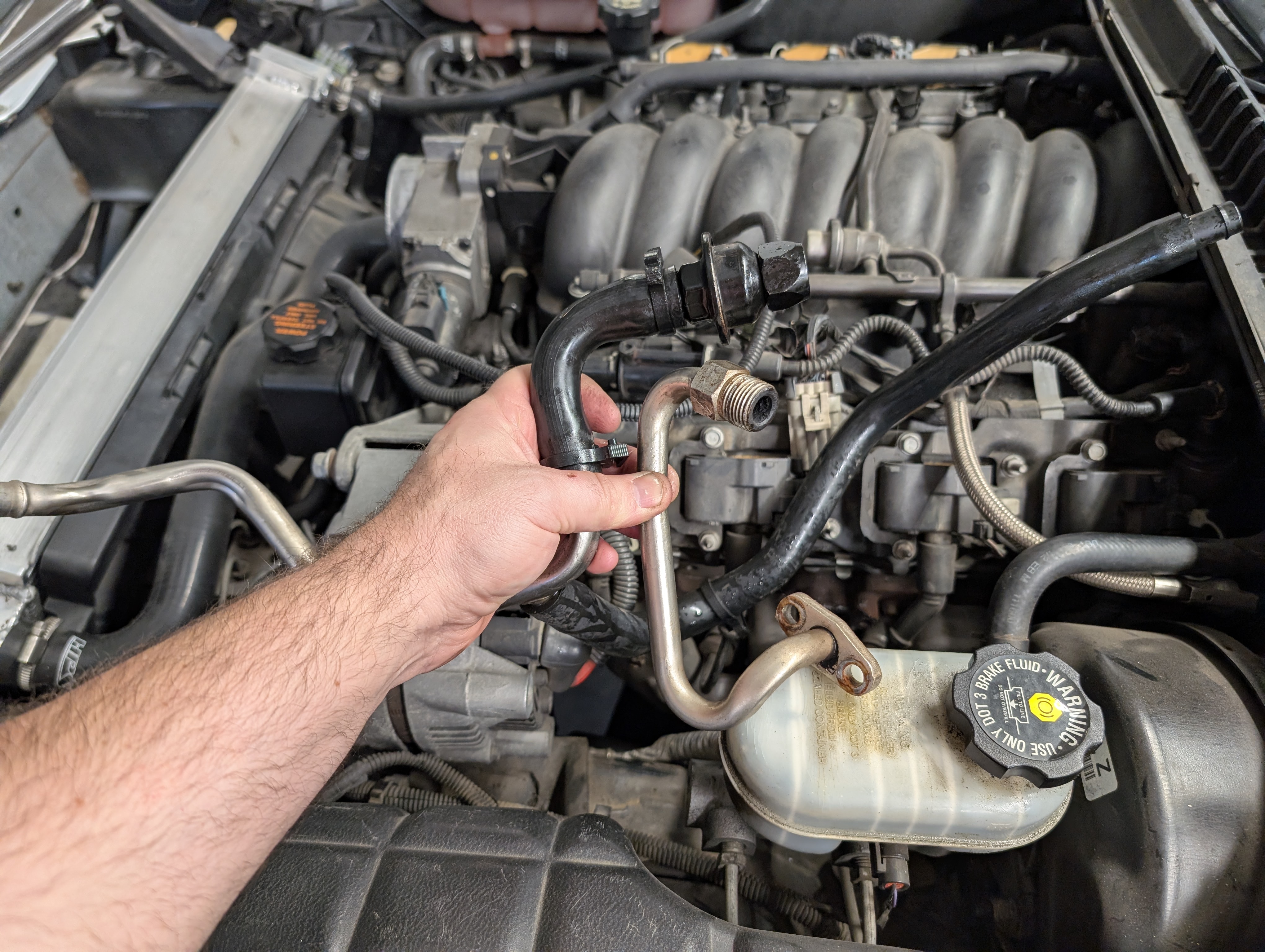 The Engine bay of a C5 Corvette with air injection system components