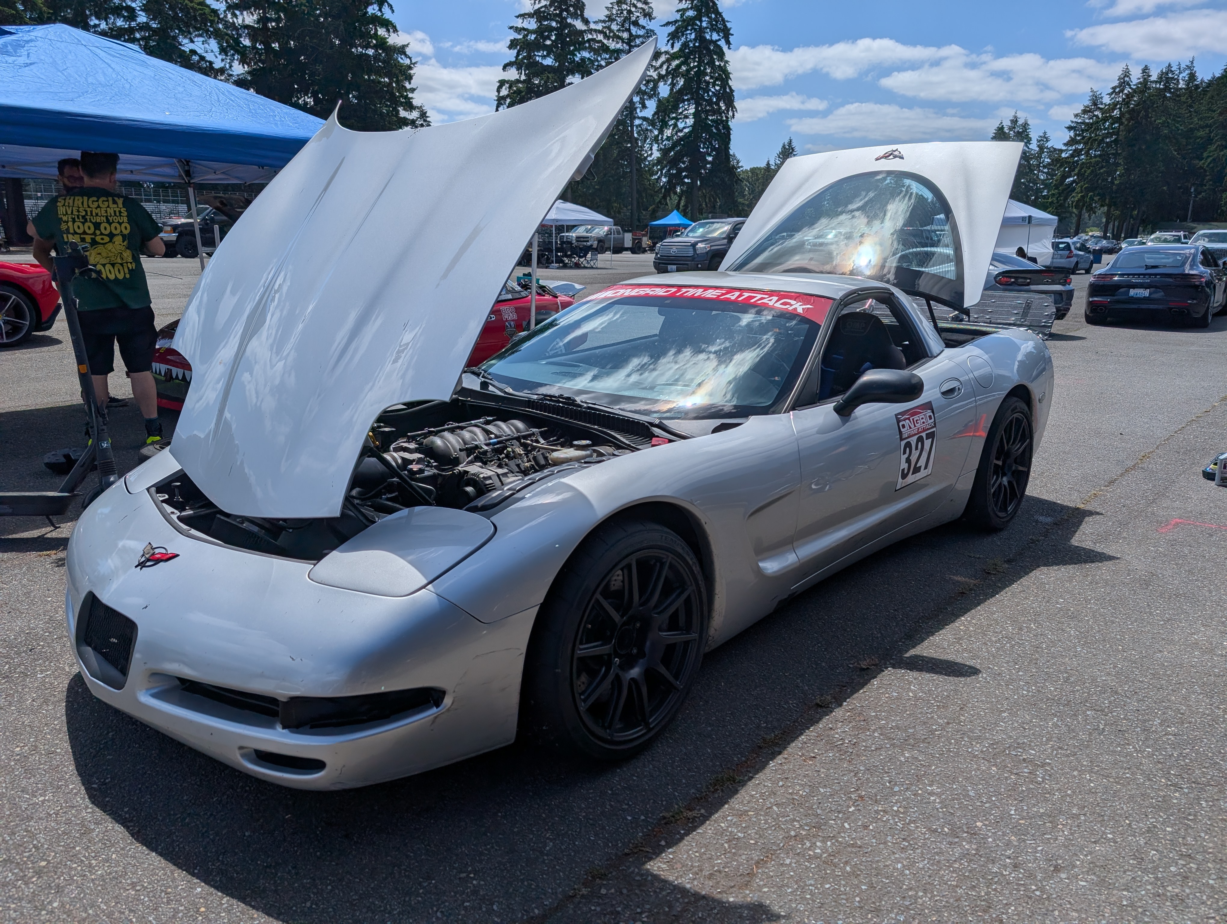 The Dead to Shred C5 Corvette at a time attack event with it's hood and trunk up.