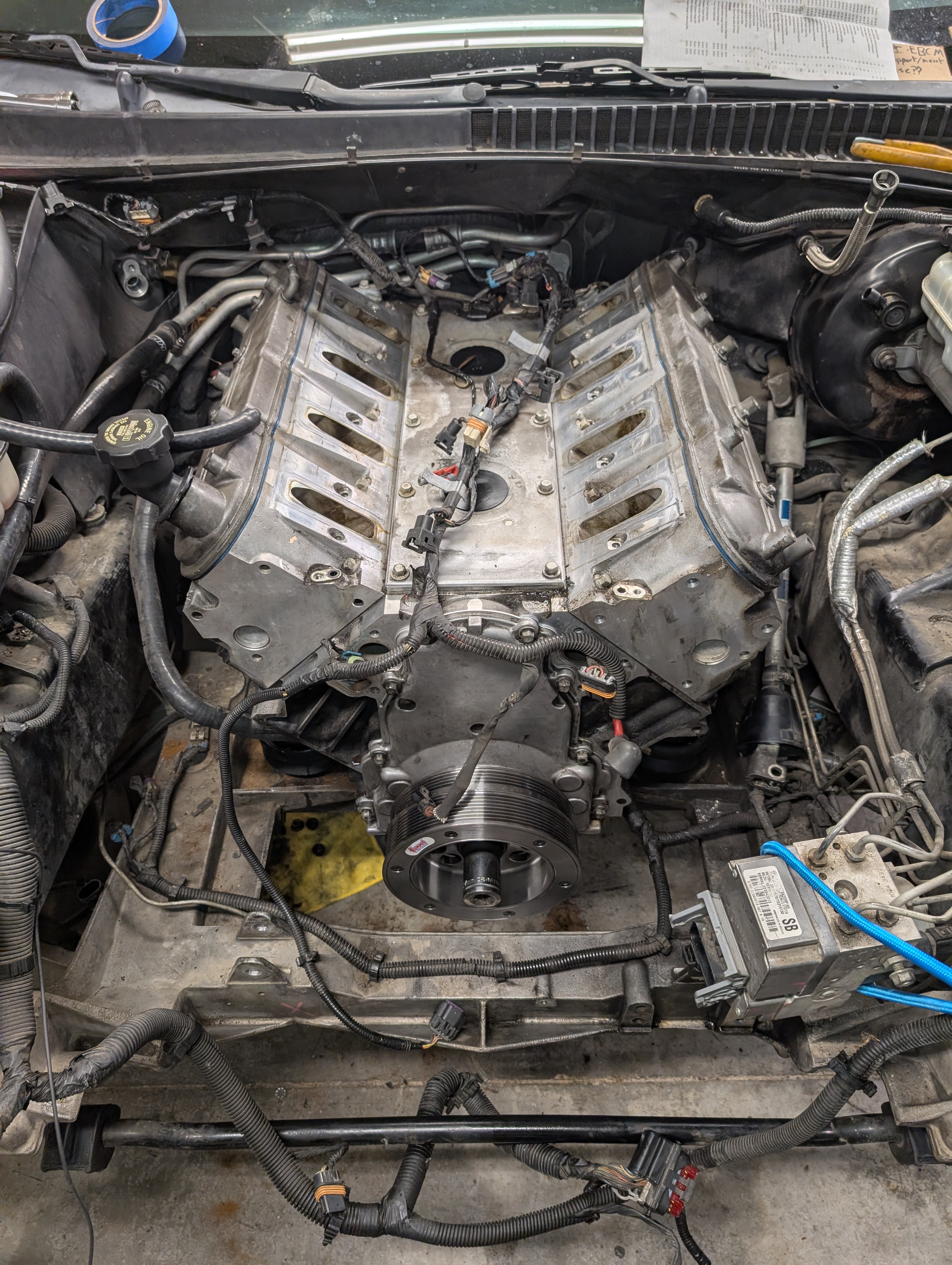 A C5 Corvette LS1 with reshly cleaned heads and a new harmonic balancer but no intake manifold.