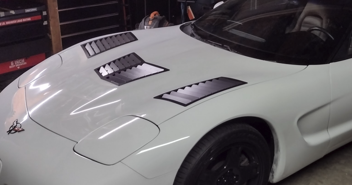 A white C5 Corvette with Trackspec Hood Vents