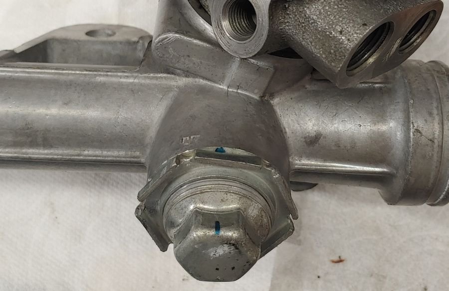 C5 Corvette steering rack cleaned up with adjuster nut adjusted and prominently pictured.
