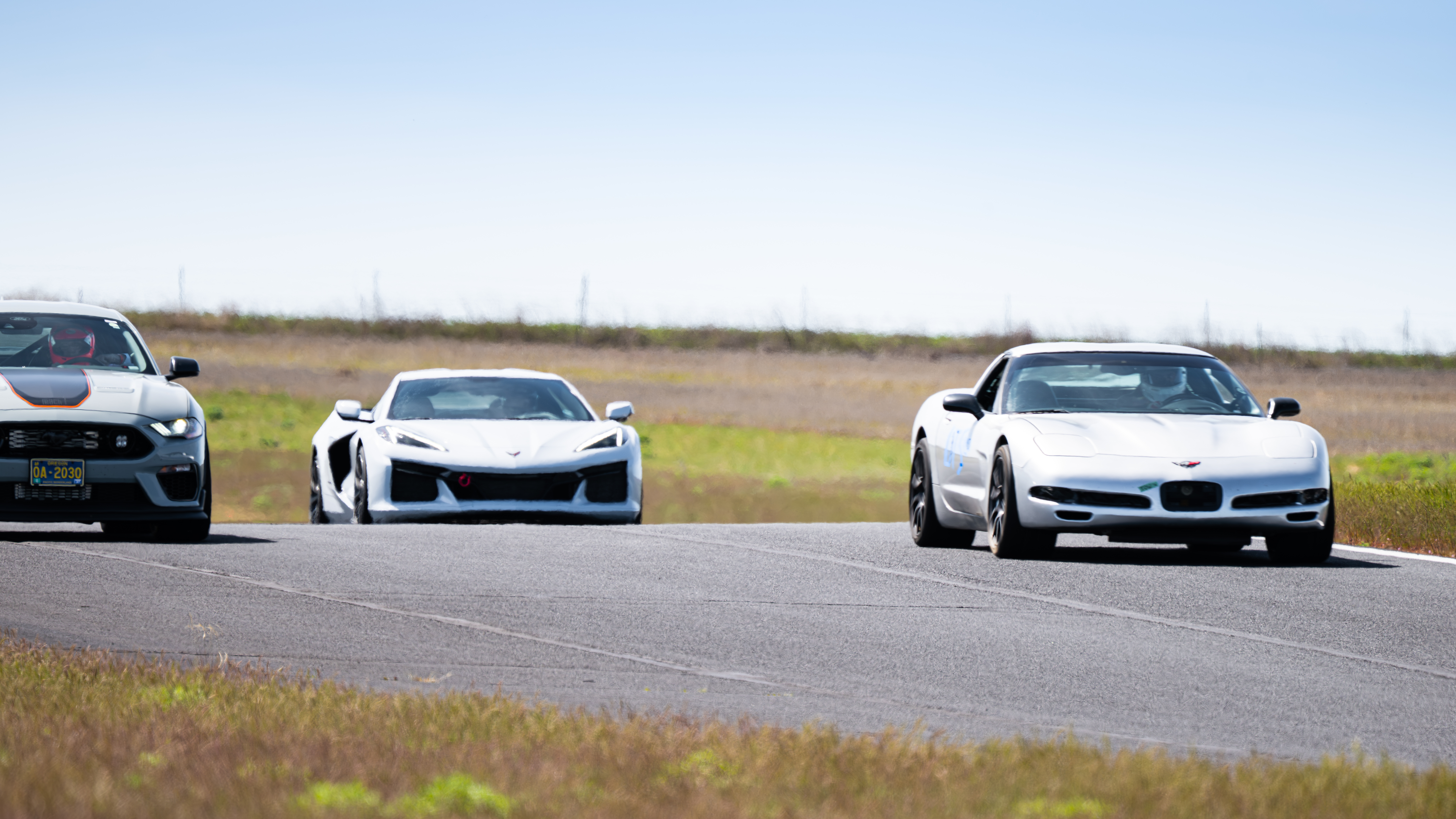 The Dead to Shred Corvette pulling on a modern mustang and C8 Corvette at ORP