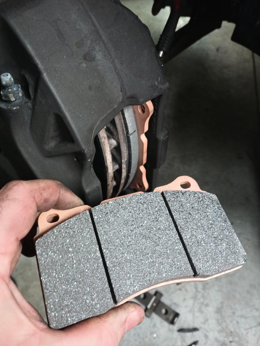 A set of EBC SR11 brake pads on a C5 Corvette with Caddy Brembo calipers. These are an endurance brake pad and are much more aggressive in appearance than standard brake pads, with a very course look and feel to the pad material