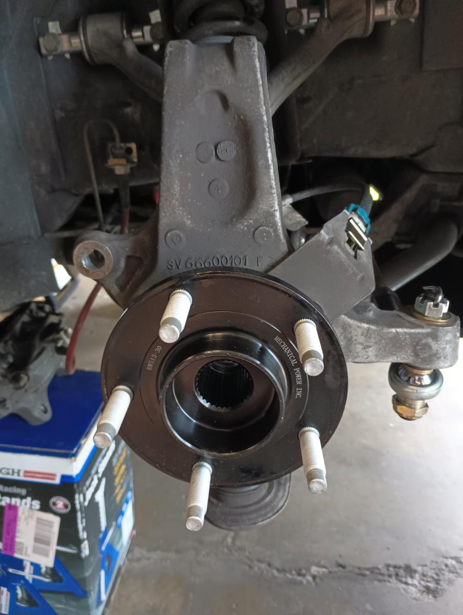 A picture of an MPI Gen 3 Wheel bearing mounted on the front knuckle of a C5 Corvette.