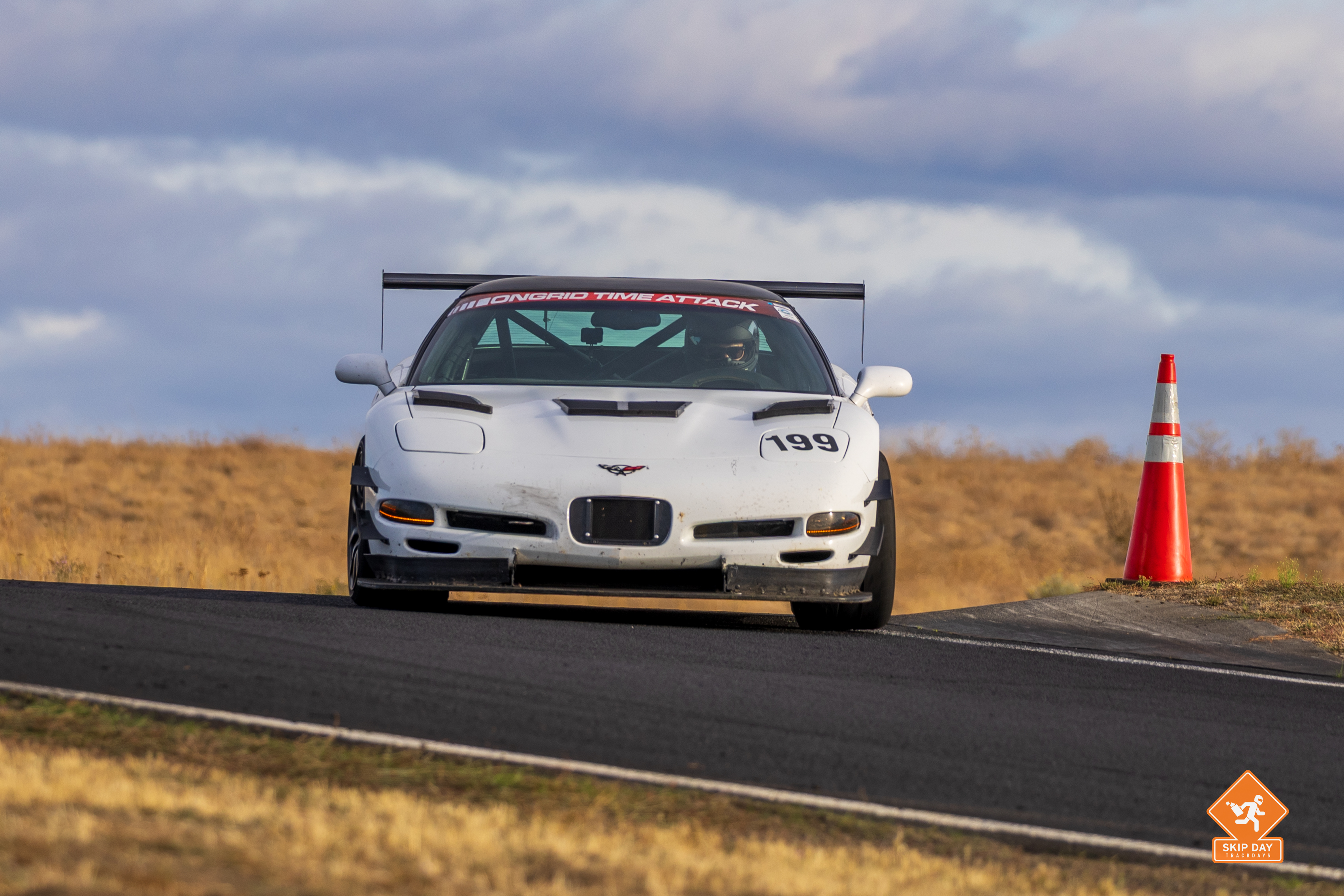 Shred Jesse's white C5 Corvette #199 making a hard left hander at ORP