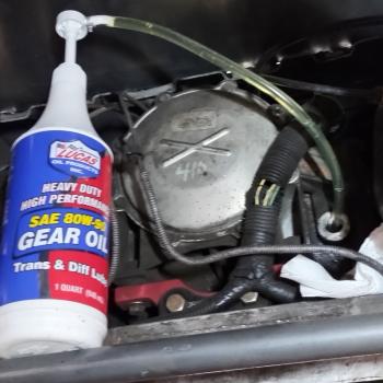 A picture of a C5 Corvette Differential with Lucas heavy duty 80w90 gear oil being transferred via hand pump.
