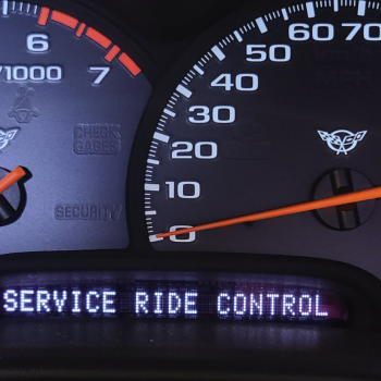 The dash of a C5 Corvette displaying SERVICE RIDE CONTROL due to an issue with the F45 or F55 magneride system.