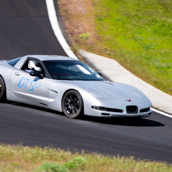 The Dead to Shred Corvette mid corner at ORP with a passenger