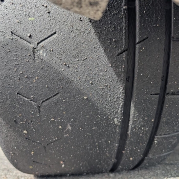 Vitour Sonic Tires as pictured with a tread on view on the ground.