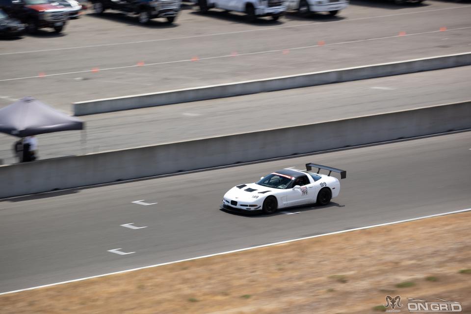 A White C5 Corvette on the front straight at The Ridge
