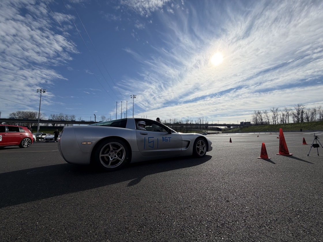 A picture of the dead to shred series C5 Corvette at the starting line. It has #151 on the side and BST written there as well.